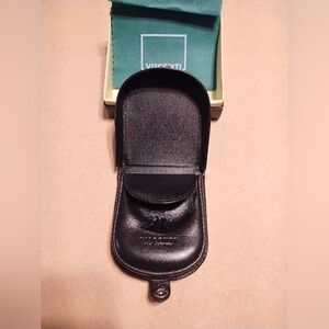 Visconti coin purse,  black leather, sturdy design and palm sized. In box.